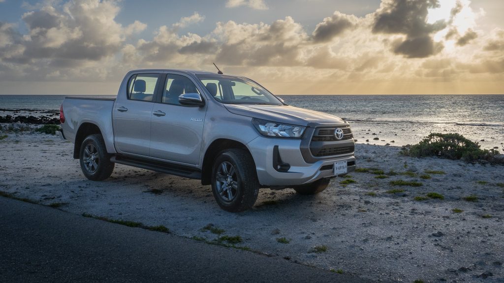 Toyota Hilux parked next to Caribbean sea