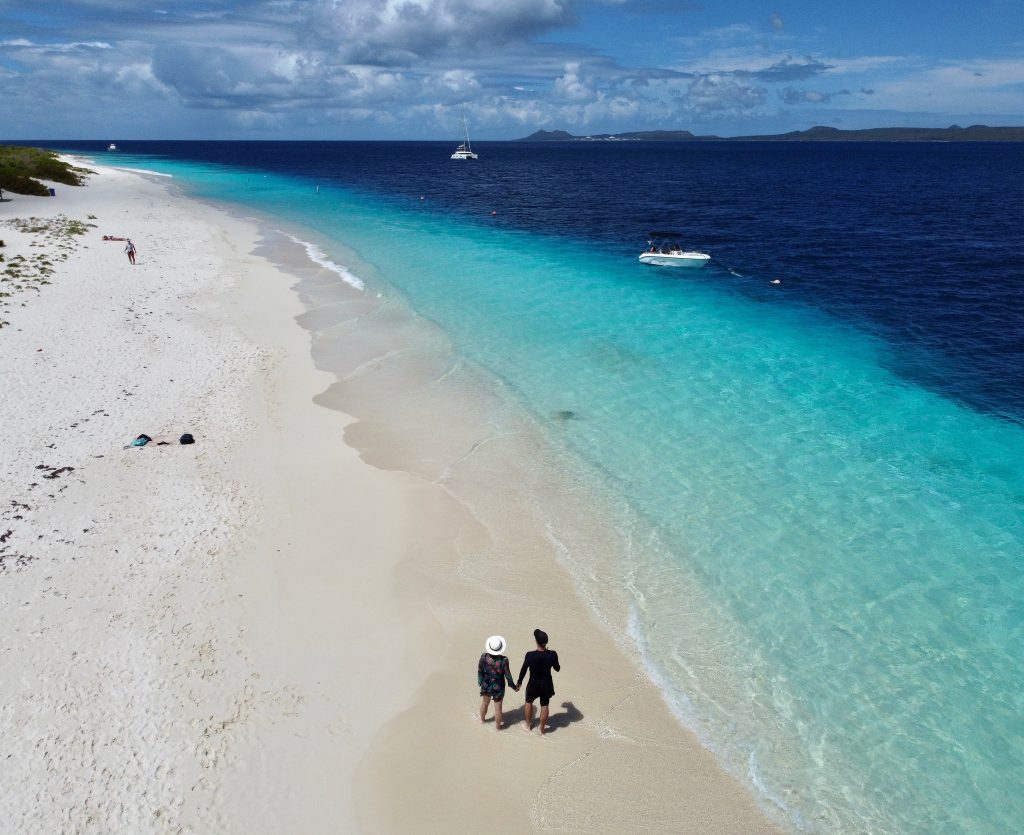 Couple walking on the beach of Klein Bonaire